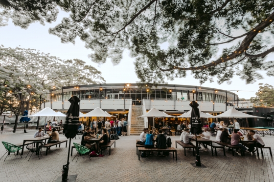 Students eating and drinking outdoors at UNSW Roundhouse