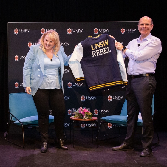 Rebel Wilson holding a UNSW Jacket