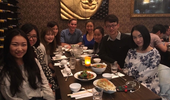 William Yang with classmates at dinner
