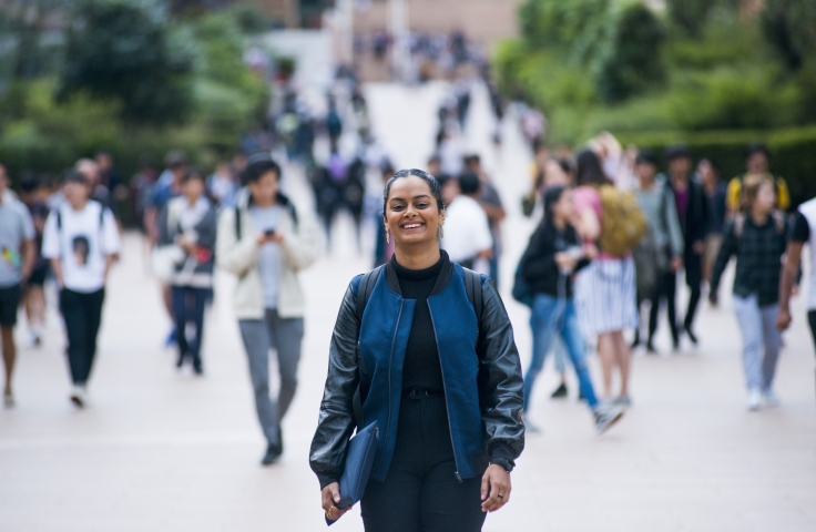 Female student walking through UNSW Kensington campus